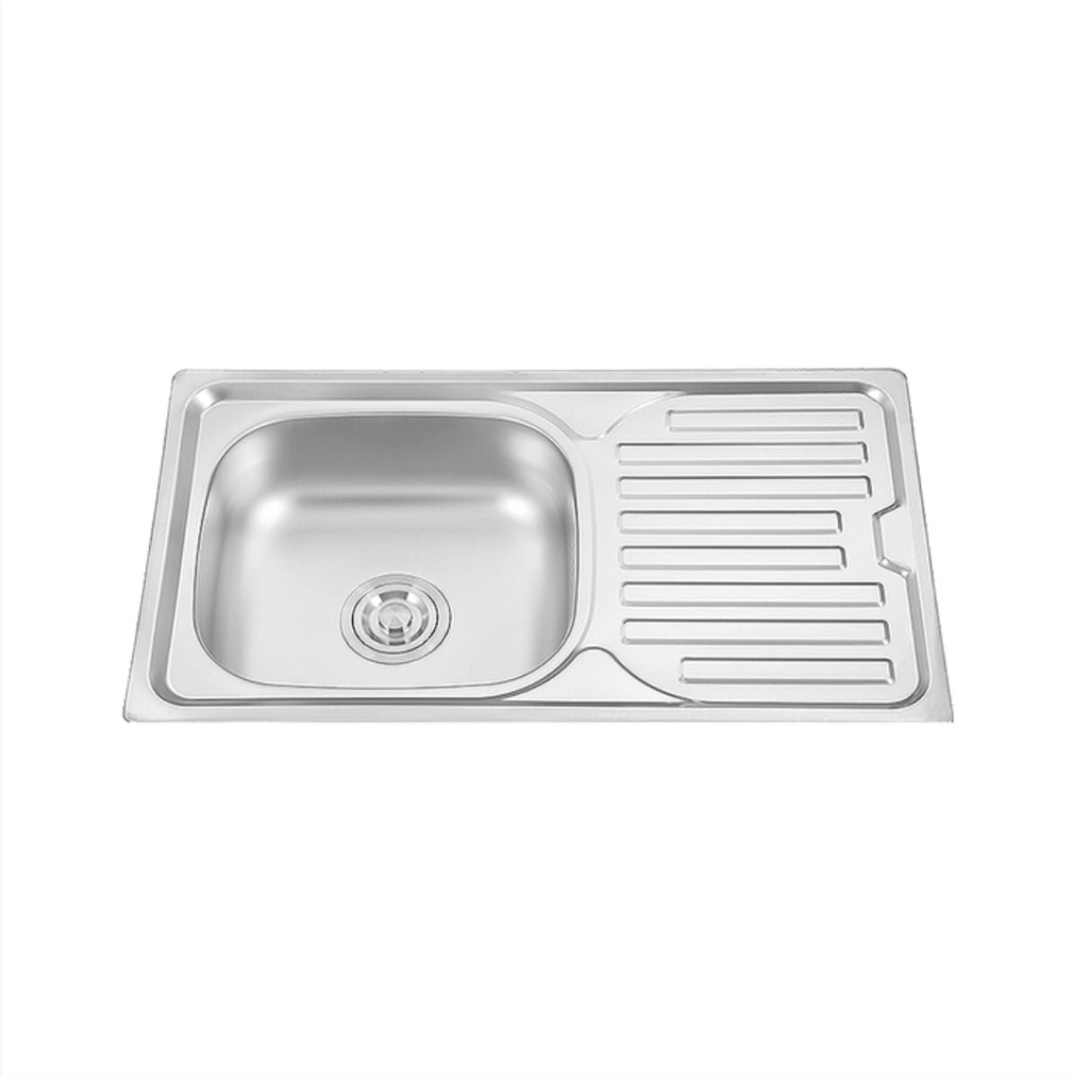 Stainless steel kitchen sink with drainboard on a white background
